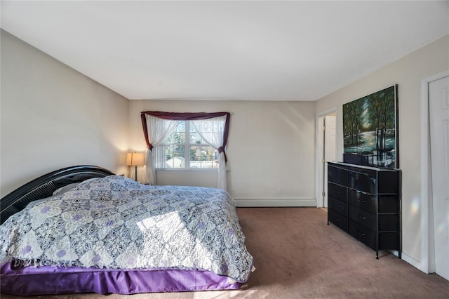 carpeted bedroom featuring baseboards and a baseboard radiator