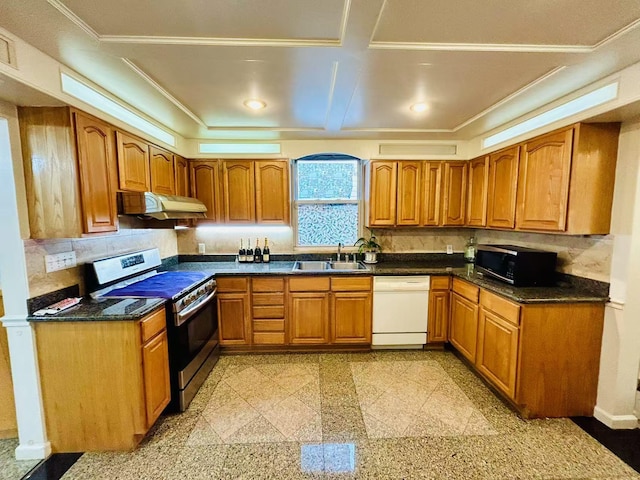 kitchen with a sink, under cabinet range hood, granite finish floor, dishwasher, and stainless steel range with gas stovetop