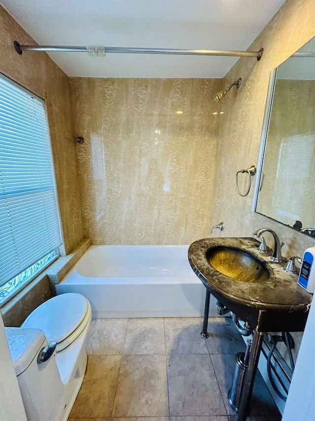 bathroom with bathing tub / shower combination and toilet