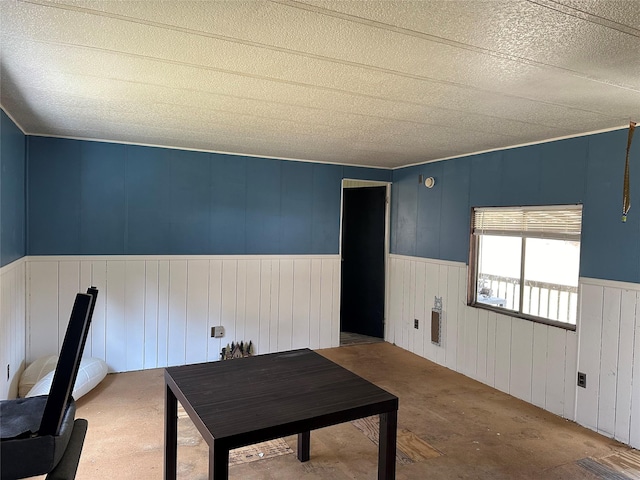 interior space featuring carpet and a wainscoted wall