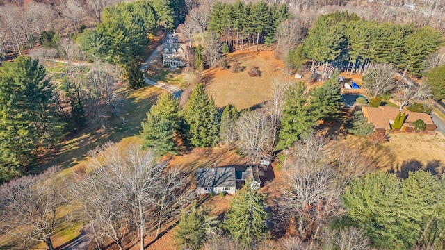 birds eye view of property with a wooded view