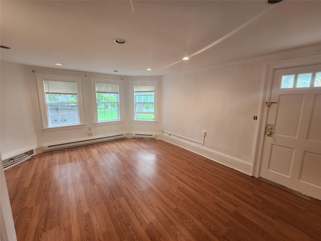 48 S St, Goshen, NY 10924 - spare room featuring plenty of natural light, wood finished floors, recessed lighting, and a baseboard radiator