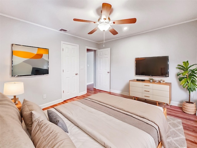 1 Charter Ln, Smithtown, NY 11787 - bedroom featuring visible vents, baseboards, wood finished floors, and crown molding