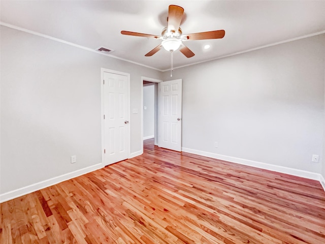1 Charter Ln, Smithtown, NY 11787 - unfurnished room featuring visible vents, baseboards, light wood-style floors, and crown molding