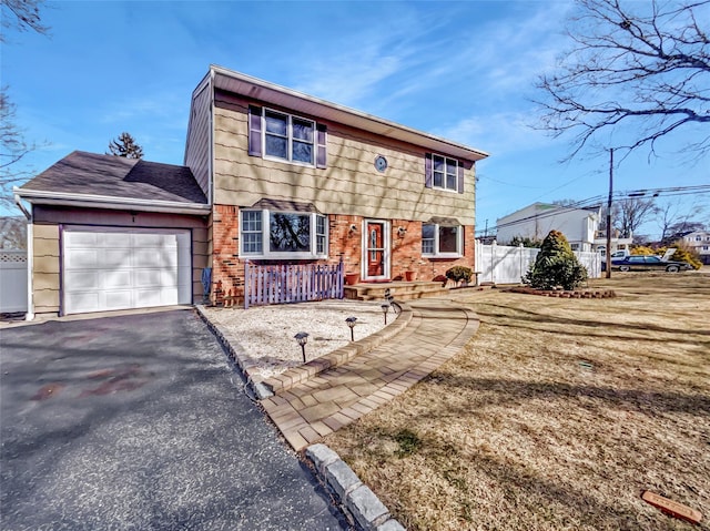 1 Charter Ln, Smithtown, NY 11787 - view of front facade featuring driveway, brick siding, an attached garage, and fence
