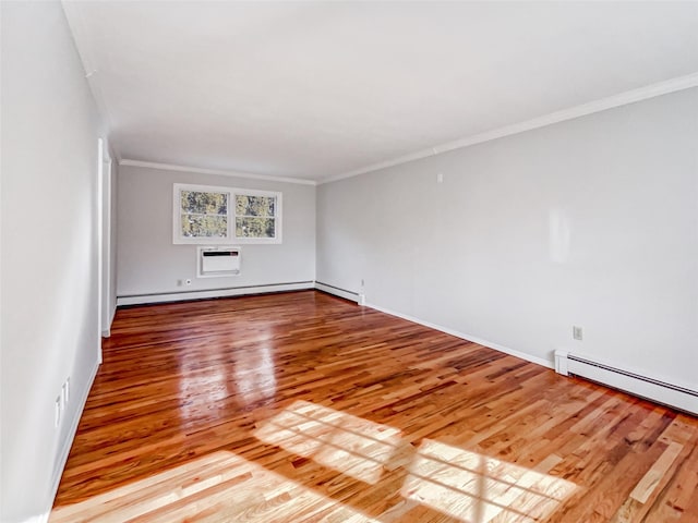 1 Charter Ln, Smithtown, NY 11787 - spare room featuring baseboard heating, ornamental molding, and wood finished floors