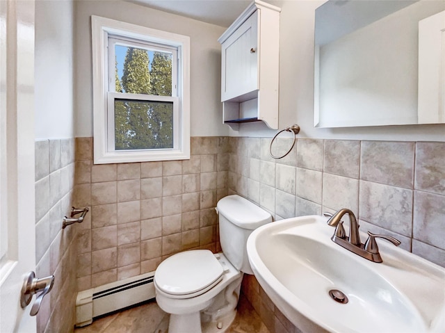 1 Charter Ln, Smithtown, NY 11787 - bathroom with a wainscoted wall, a baseboard radiator, toilet, tile walls, and a sink