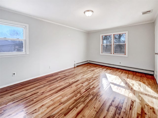 1 Charter Ln, Smithtown, NY 11787 - empty room with ornamental molding, wood finished floors, a wealth of natural light, and a baseboard radiator
