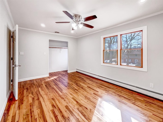 1 Charter Ln, Smithtown, NY 11787 - unfurnished bedroom with light wood finished floors, baseboards, ornamental molding, baseboard heating, and a closet