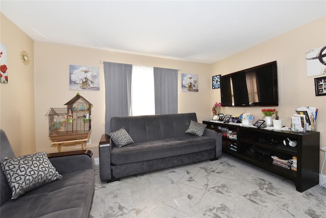 living room with marble finish floor