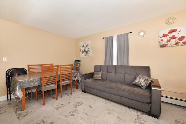 living room with marble finish floor, a baseboard heating unit, and baseboards