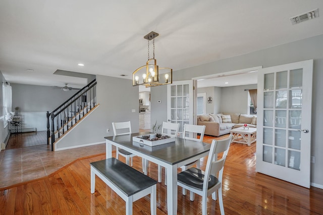 dining area with visible vents, recessed lighting, stairs, and hardwood / wood-style floors