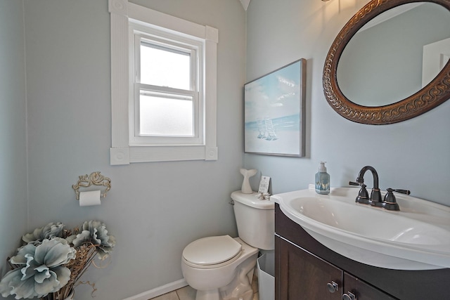 bathroom featuring toilet and vanity