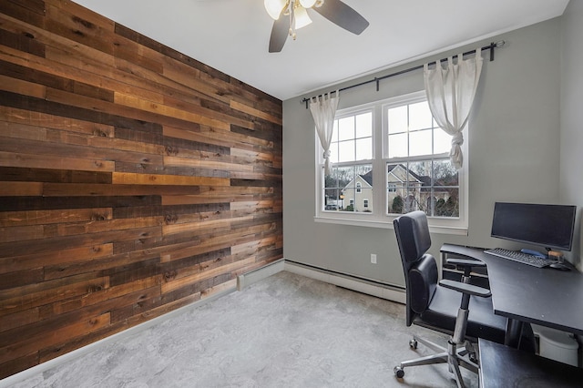 office space featuring concrete flooring, wood walls, and a ceiling fan