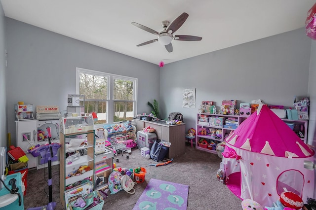 recreation room with ceiling fan and carpet floors