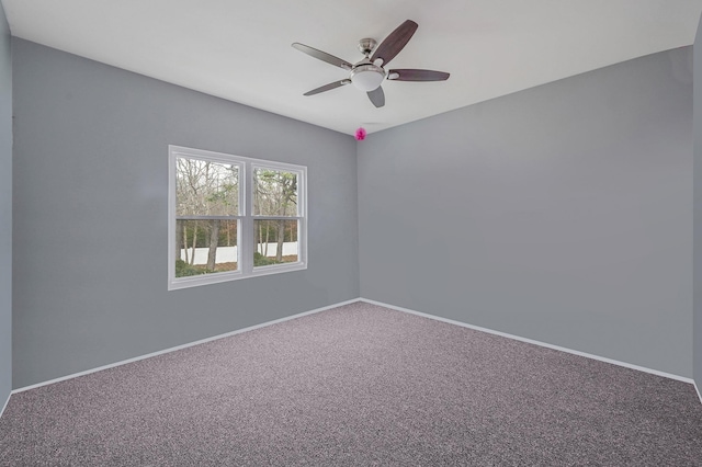 empty room featuring a ceiling fan, baseboards, and carpet floors