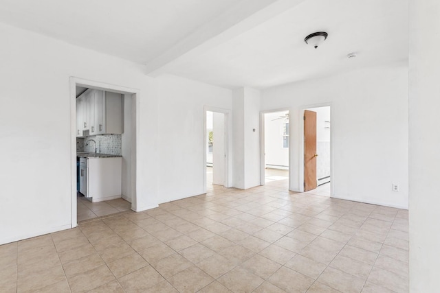 unfurnished room with beamed ceiling, light tile patterned flooring, and a baseboard radiator