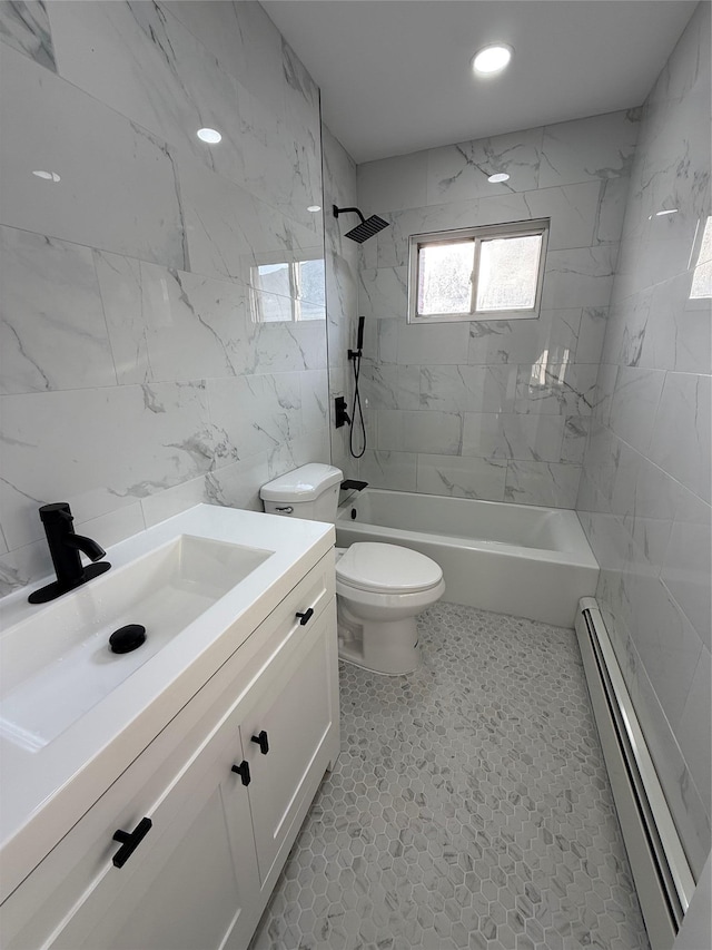 full bathroom with vanity, a baseboard heating unit, bathing tub / shower combination, toilet, and tile walls