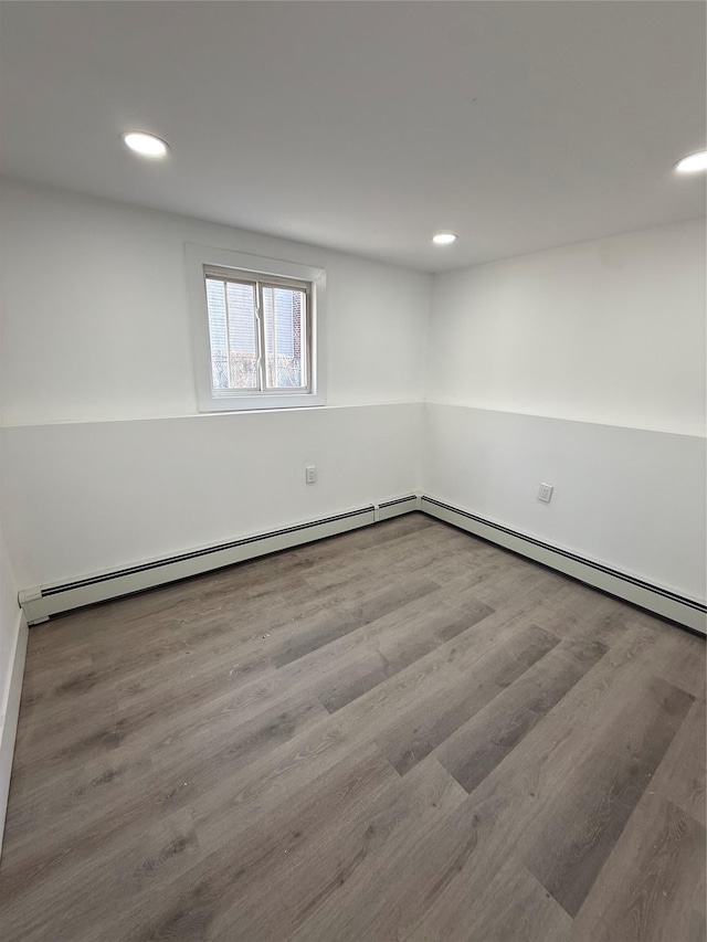 spare room with recessed lighting and wood finished floors