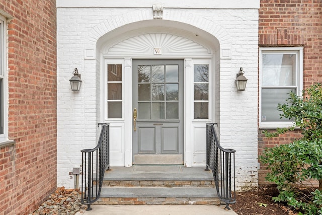 property entrance with brick siding