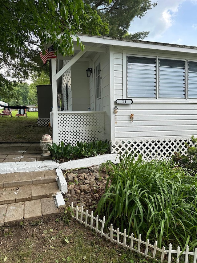 view of front of home featuring fence