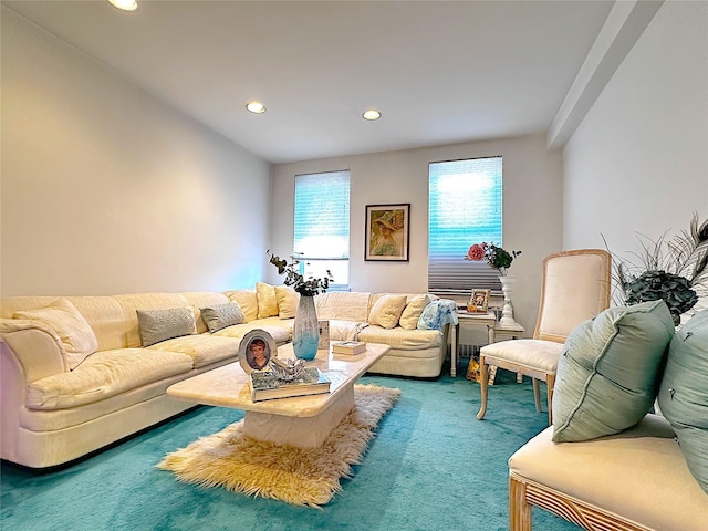 carpeted living area with recessed lighting