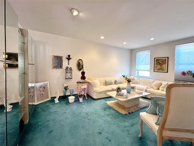 living area with recessed lighting, dark colored carpet, and baseboards