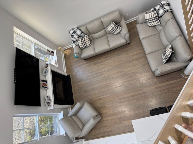 living room with wood finished floors and baseboards