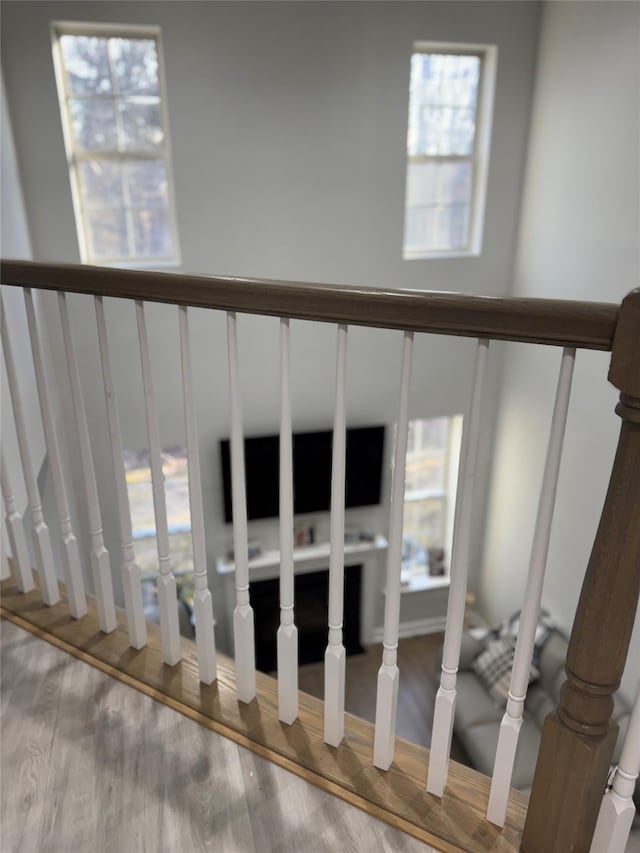 stairway with wood finished floors