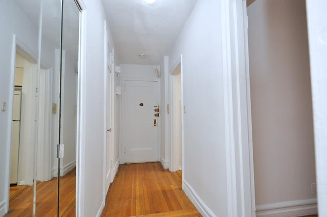 hall with light wood-style flooring