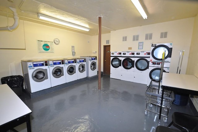 community laundry room with washer and clothes dryer and visible vents