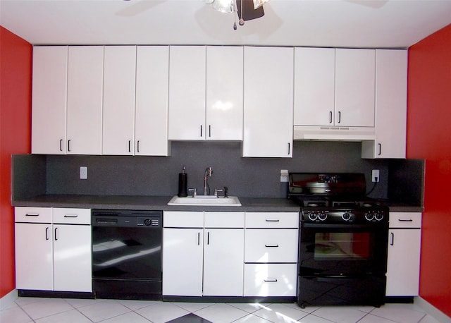 kitchen featuring under cabinet range hood, decorative backsplash, white cabinets, black appliances, and a sink