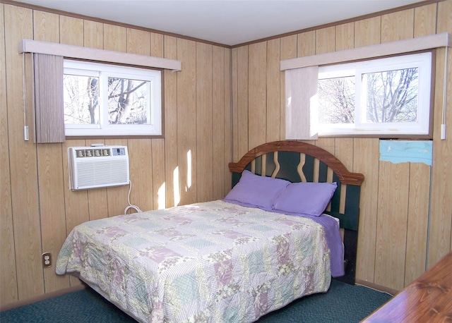 bedroom featuring wooden walls, an AC wall unit, and carpet flooring