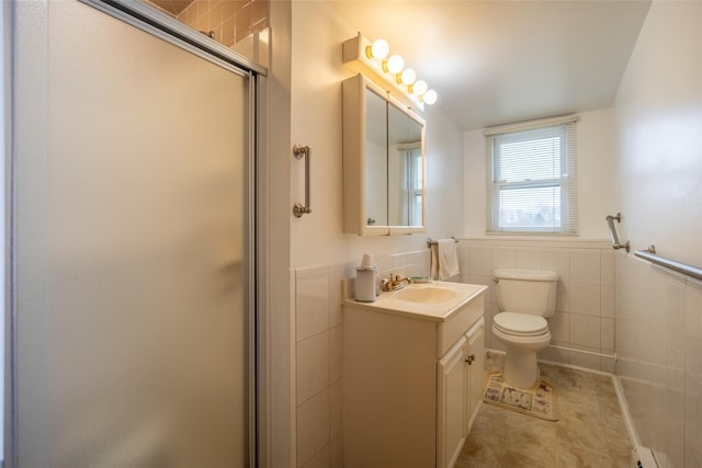 full bath with a shower stall, toilet, tile walls, and a wainscoted wall