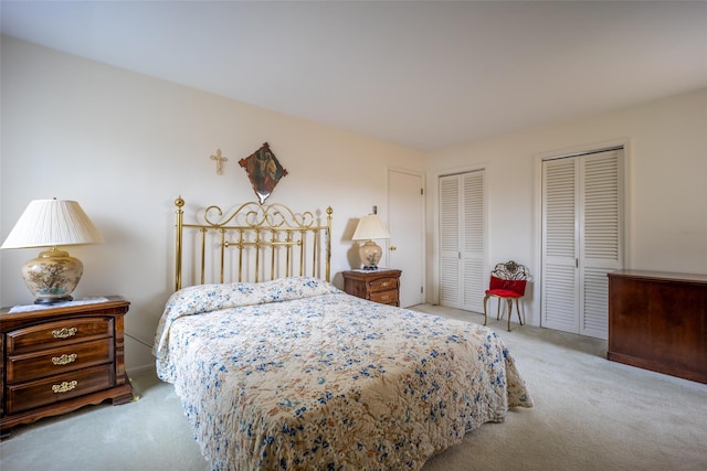 carpeted bedroom with two closets