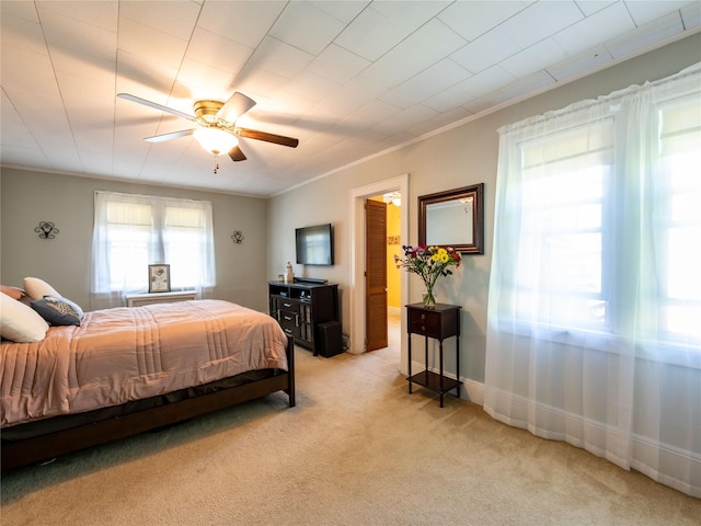679 Saint Lukes Pl, Baldwin, NY 11510 - bedroom featuring light carpet, crown molding, ceiling fan, and baseboards