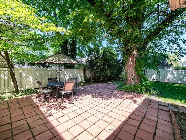 679 Saint Lukes Pl, Baldwin, NY 11510 - fenced backyard featuring a patio area and outdoor dining space