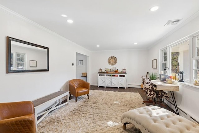 interior space featuring visible vents, a baseboard heating unit, wood finished floors, and crown molding