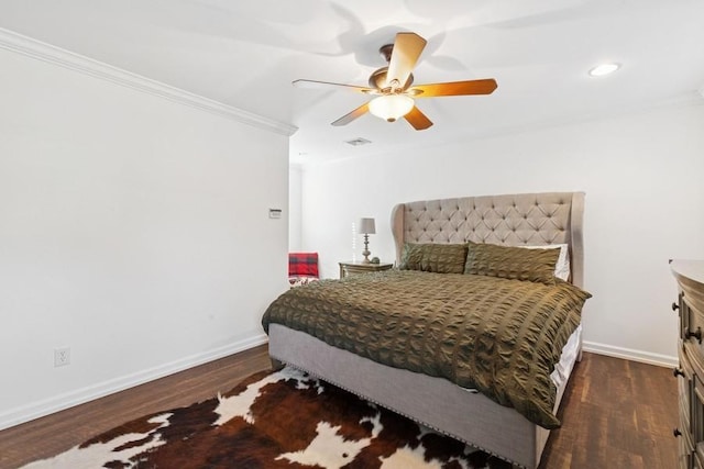 bedroom with wood finished floors, a ceiling fan, baseboards, and ornamental molding