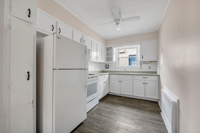 kitchen with a sink, open shelves, dark wood finished floors, white cabinetry, and white appliances