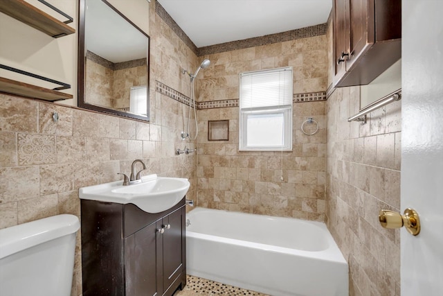 full bath with vanity, tile walls, toilet, and tub / shower combination