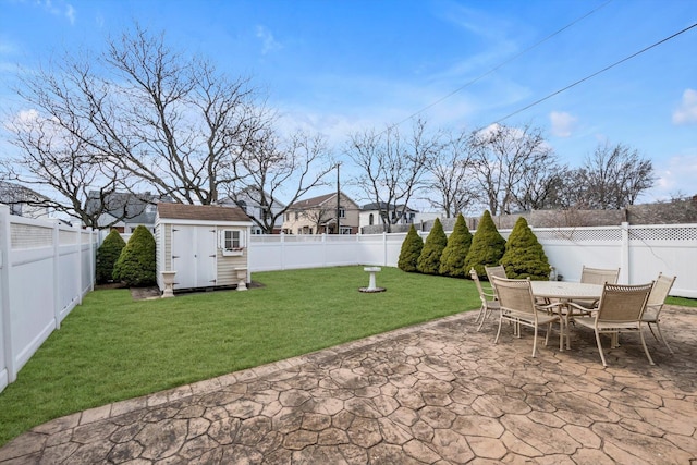 view of patio with a fenced backyard, outdoor dining area, a storage shed, and an outdoor structure