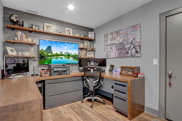 office space with visible vents and light wood finished floors