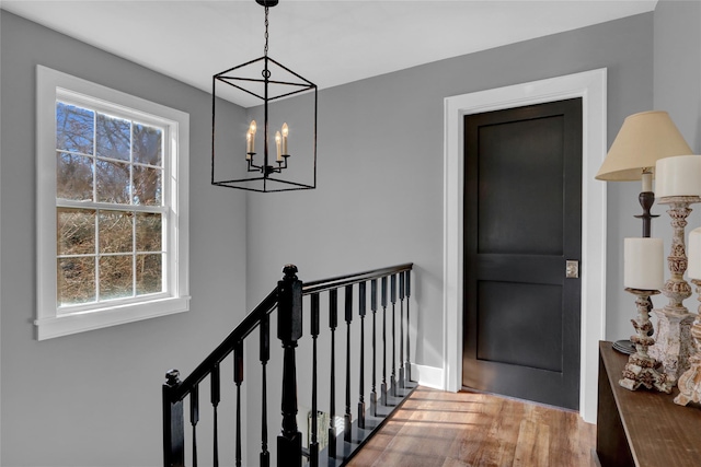 interior space with an inviting chandelier and wood finished floors