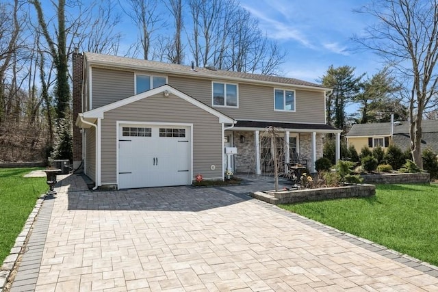 traditional-style home featuring a front lawn, central air condition unit, a chimney, decorative driveway, and a garage