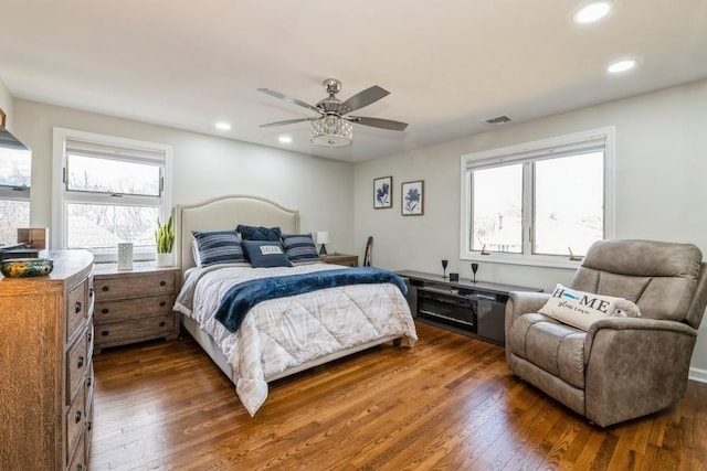 bedroom featuring recessed lighting, visible vents, ceiling fan, and dark wood-style flooring