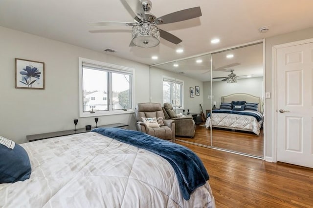 bedroom featuring recessed lighting, visible vents, and wood finished floors