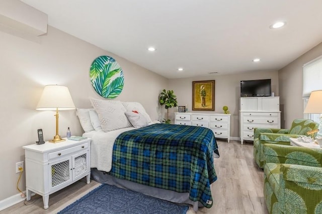 bedroom with recessed lighting, light wood-type flooring, and baseboards