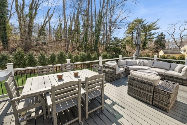 deck featuring outdoor dining area and outdoor lounge area