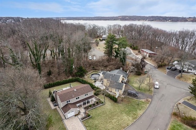 birds eye view of property featuring a water view